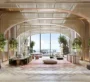 Costa Mare at Al Marjan – Luxurious lobby reception with wood accents