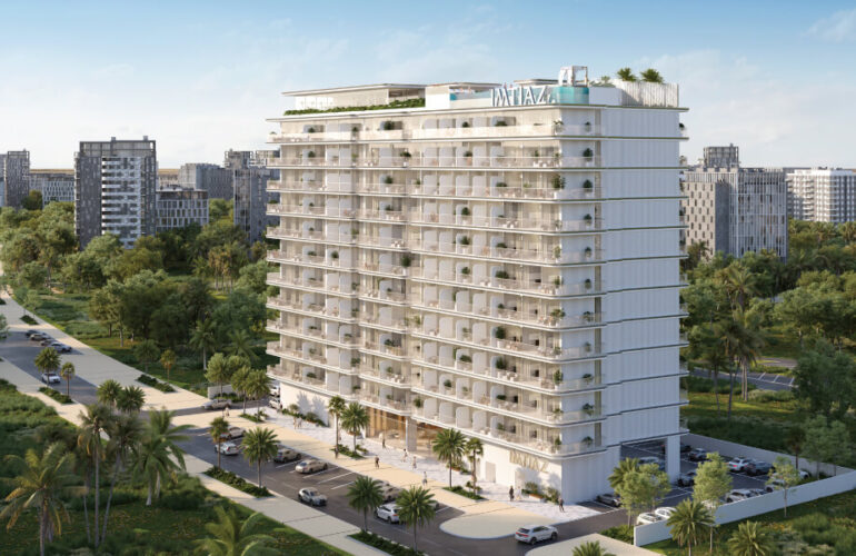 Exterior view of Cove Edition 6 in Dubai, showing the elegant mid-rise residential tower surrounded by greenery.