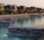 Picturesque lagoon waterfall feature with tranquil views at DAMAC Islands Phase 2.