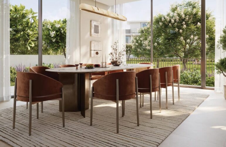 Elegant dining area at Selvara, featuring a contemporary table set and garden views.