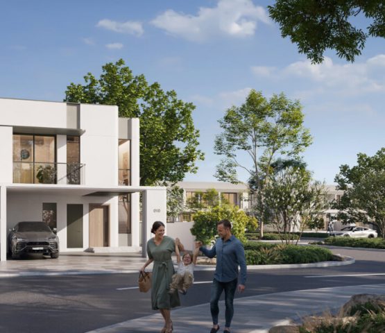 A photo of a white villa facing a road