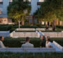 Green landscaped garden with sunken seating area for social gatherings at Expo Living