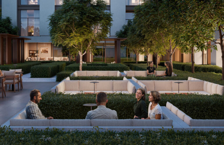 Green landscaped garden with sunken seating area for social gatherings at Expo Living