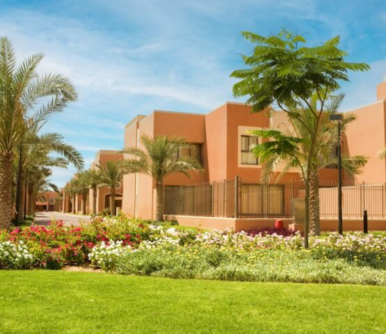 A stunning luxury villa surrounded by lush greenery, offering an exclusive waterfront lifestyle at Mangrove Village, Abu Dhabi.