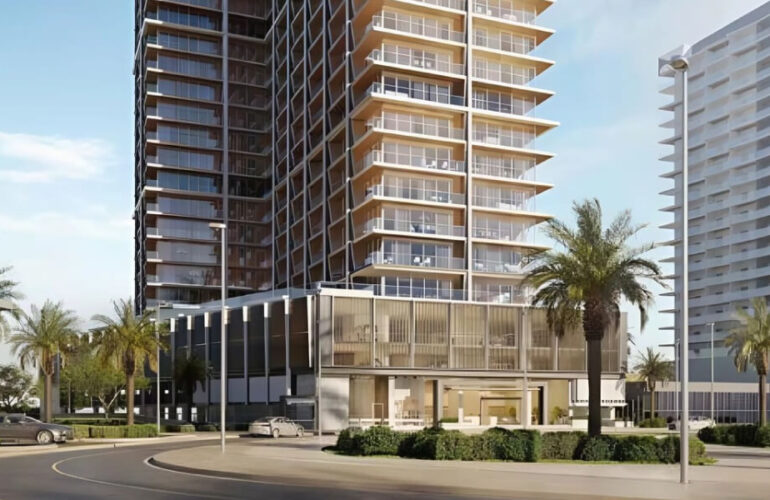 Modern high-rise residential tower of Binghatti Starlight in Dubai with palm trees