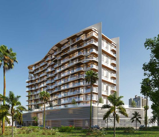 A photo of an apartment surrounded by greenery