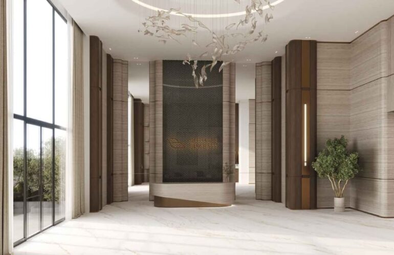 Elegant lobby entrance with marble flooring and chandelier at Binghatti Hillviews