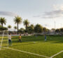 Greenspoint at Emaar South foot ball A football field with natural grass, featuring two goals and a marked field