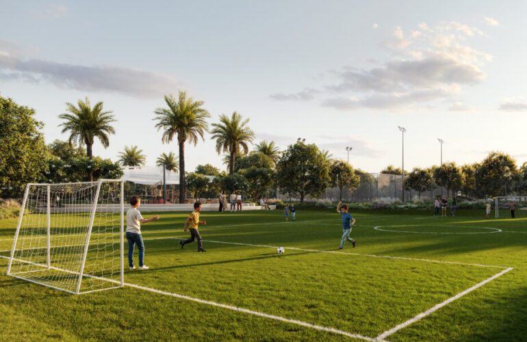 Greenspoint at Emaar South foot ball A football field with natural grass, featuring two goals and a marked field