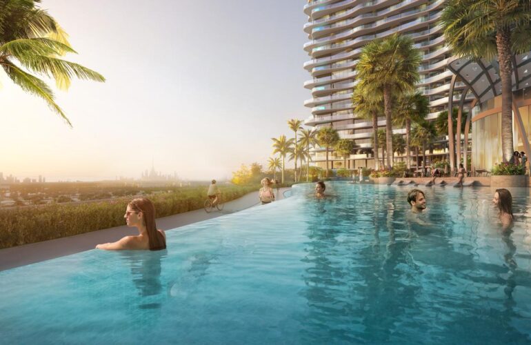 Infinity pool at Laguna Residence in Dubai with a view of the city. People are swimming in the pool, which is located at a high elevation. The apartment is seen from two angles in this photo.