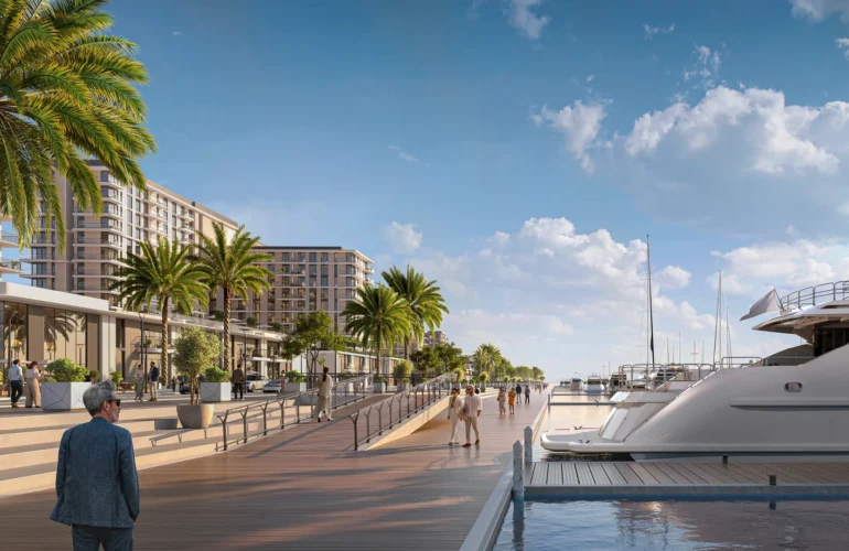 Pier Point 2 Man walking along luxury yacht marina flanked by modern buildings