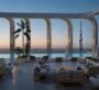 Elegant terrace with seating and pool area at DWTN Residences in Dubai