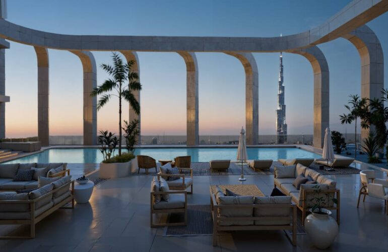 Elegant terrace with seating and pool area at DWTN Residences in Dubai