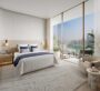 Bright and modern bedroom interior with large windows and balcony at Dubai Harbour Residences