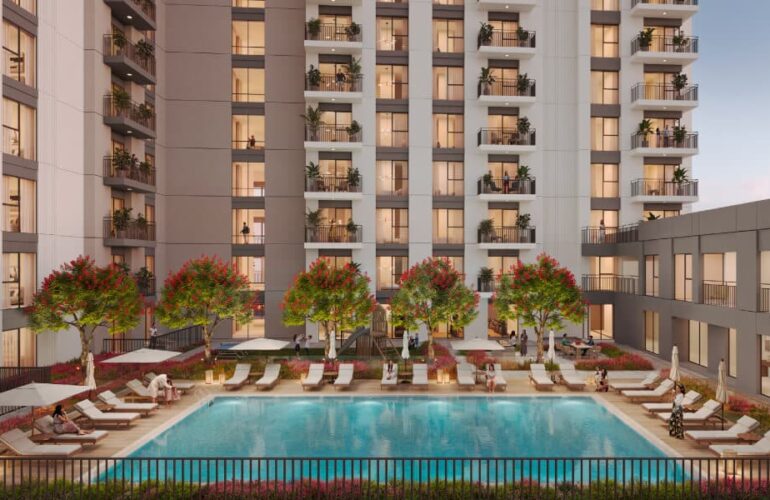 Outdoor pool with sun loungers at Camden project in Dubai