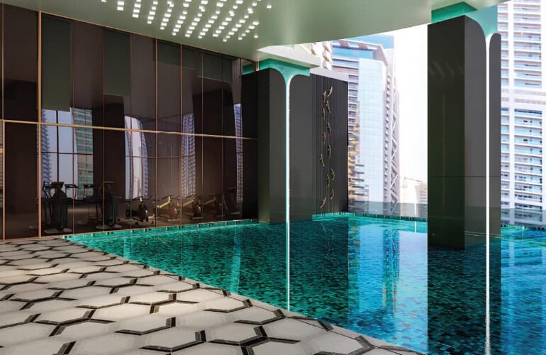 Indoor pool with luxurious design and cityscape view at MBL Signature Dubai