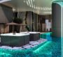 Poolside relaxation area with sunbeds and luxury seating at MBL Signature Dubai