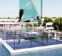 Unique floating paddle tennis court beside ME DO RE Business tower surrounded by water features.c