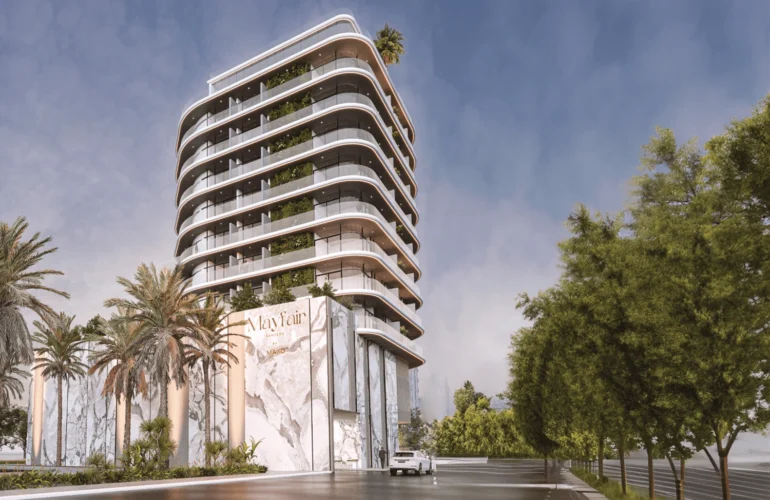 Mayfair Gardens Dubai – Contemporary building with curved façade and palm trees