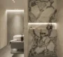 Mayfair Gardens Dubai – Minimalist modern bathroom with floating vanity