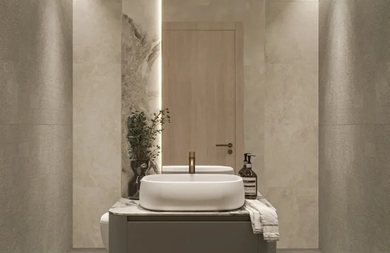 Mayfair Gardens Dubai – Bathroom with marble wall and modern fixtures