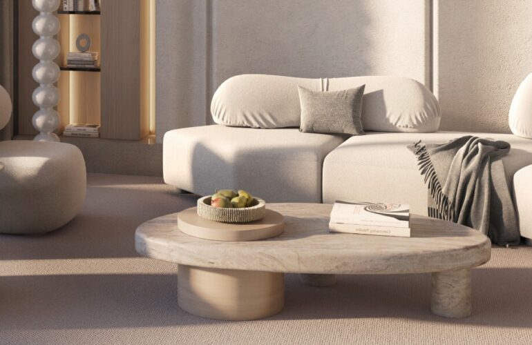 Elegant minimalist living room interior with cream tones and soft modern furniture.