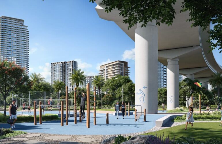 Modern children’s play area at Silva by Emaar in Dubai, surrounded by greenery and high-rise towers.
