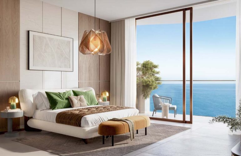 Modern bedroom suite with balcony and ocean view at The Mural by Beyond in Dubai