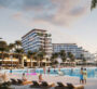 A small beach in the Pierside Marina Residences project where children are swimming, with a large building across from them.