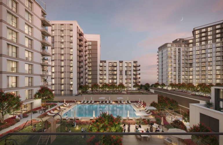 Inviting pool and lounge space at Alton by Nshama, Dubai, surrounded by greenery and homes.