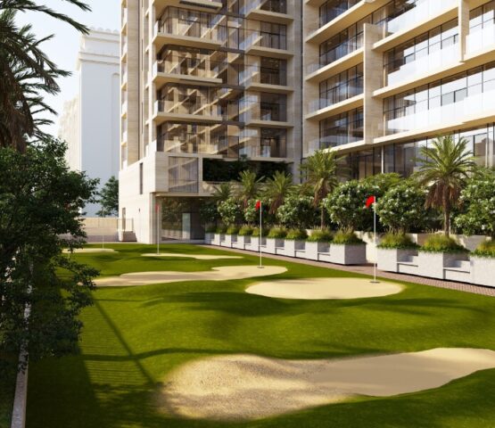 Mini putting green surrounded by luxury residences and landscaped palm trees at Solaia Residences Dubai.