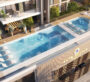Luxury rooftop pool area at Gate Royale Residences with seating and sunbeds