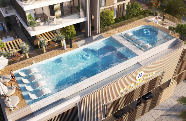 Luxury rooftop pool area at Gate Royale Residences with seating and sunbeds