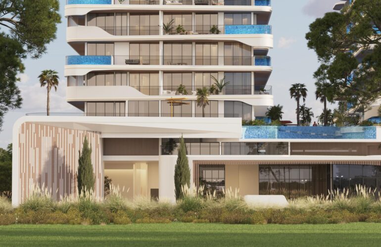 Entrance of the SAMANA Ocean Pearl apartment in Dubai, starting with green spaces and grass, leading to the apartment's entrance door