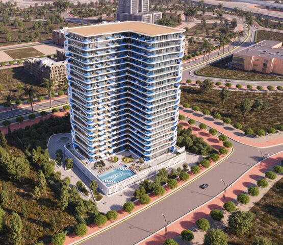 Front view of Samana Ibiza in Dubai, a white apartment surrounded by green spaces. Nearby streets are visible, and the photo is taken from above