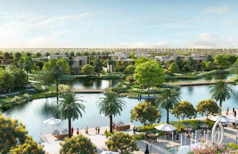 he Acres Estates at Dubailand Villa An aerial photo showing an island with a river flowing through the center. Trees surround the island, and the land around it resembles a beach.