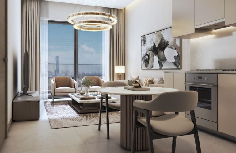 Elegant open-plan kitchen and dining area in The Eden apartment with modern furniture