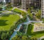 Green outdoor sports area in The Eden community with football field and walking tracks