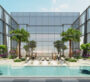 A large pool at The Element at Sobha One Apartments in Dubai, surrounded by small glass walls resembling windows. Palm trees surround the pool, and the sky is clear and blue.