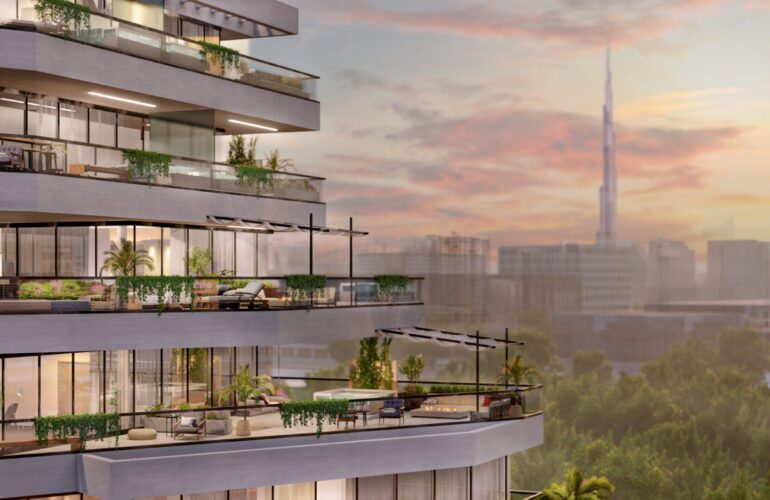 A balcony of an apartment at Trinity Balcony-Closeup in Dubai, overlooking a green space with the city and Burj Khalifa visible in the distance.