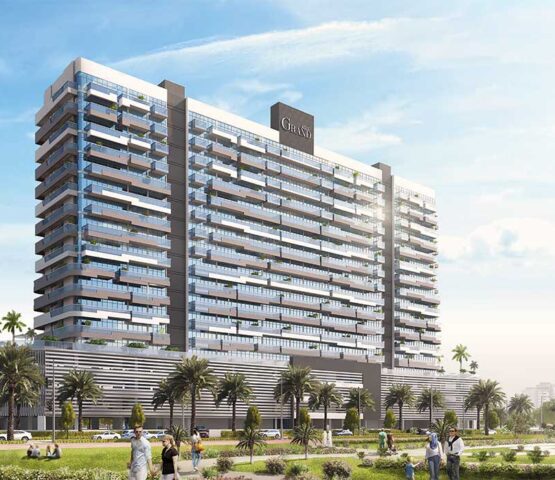 Daytime view of Azizi Grand tower in Dubai with open outdoor space