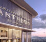 Entrance of Voxa by Pantheon with illuminated signage and cityscape backdrop