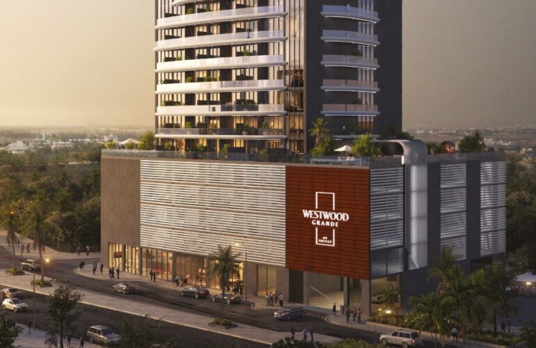 Street view of Westwood Grande tower with branded signage and modern facade