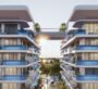 Front view of Samana Ocean Pearl 2 in Dubai, an apartment on top of a mountain or green hill, with a white and blue house. The photo was taken from the front of the apartment.