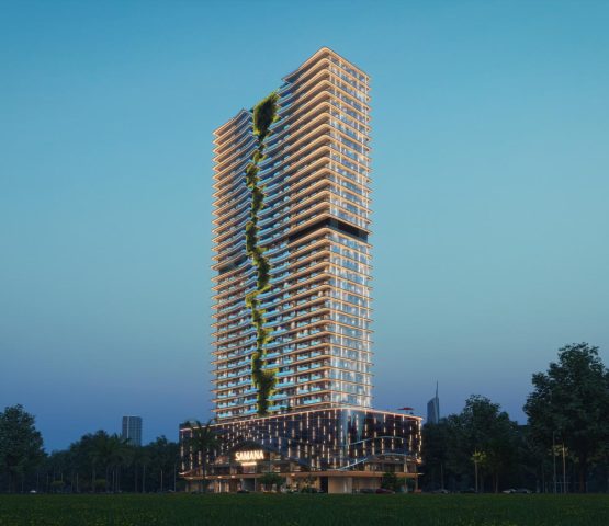 A photo in front of a white penthouse belonging to Samana company