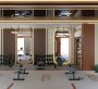 A photo of the inside of a gym with two tables with two bars in front of them