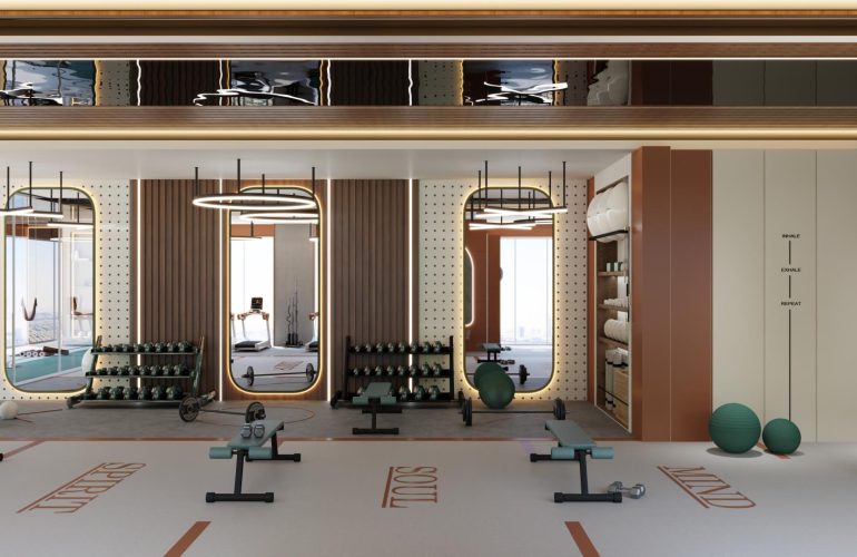 A photo of the inside of a gym with two tables with two bars in front of them